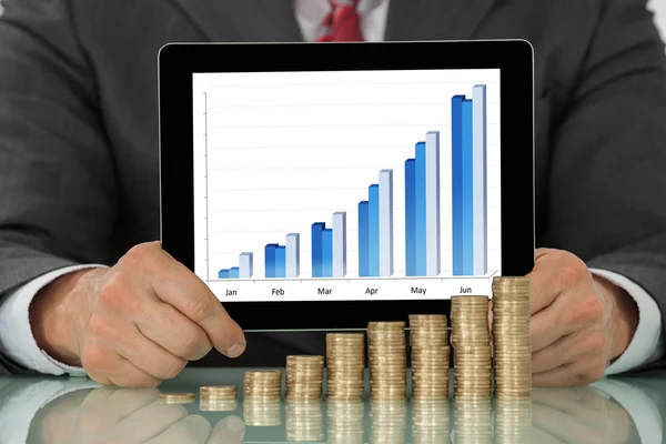 Tablet Near Coins At Desk — Stock Photo, Image