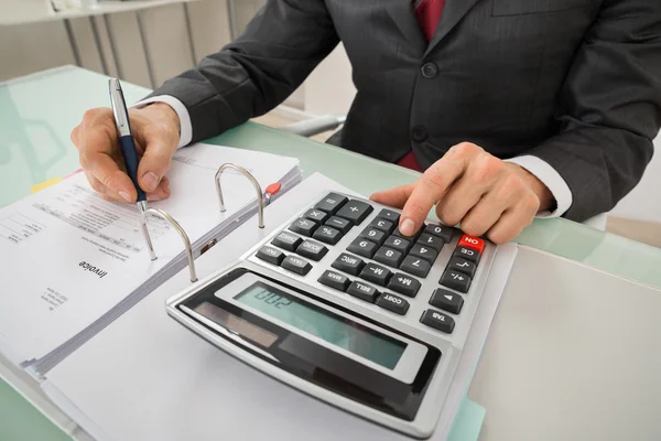 Businessman Calculating Invoice — Stock Photo, Image