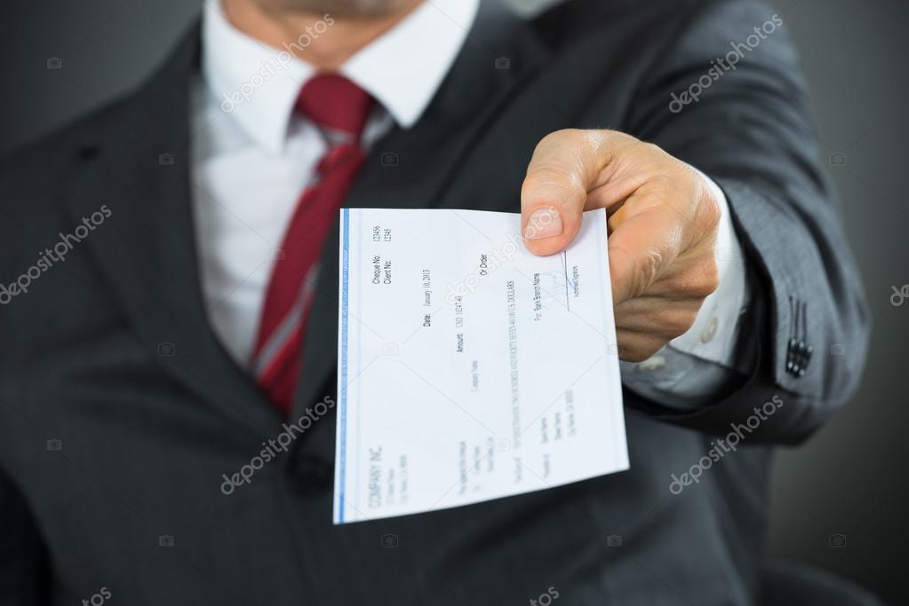 Businessman Hand Giving Cheque