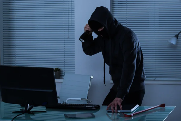 Robber With Flashlight In Office — Stock Photo, Image