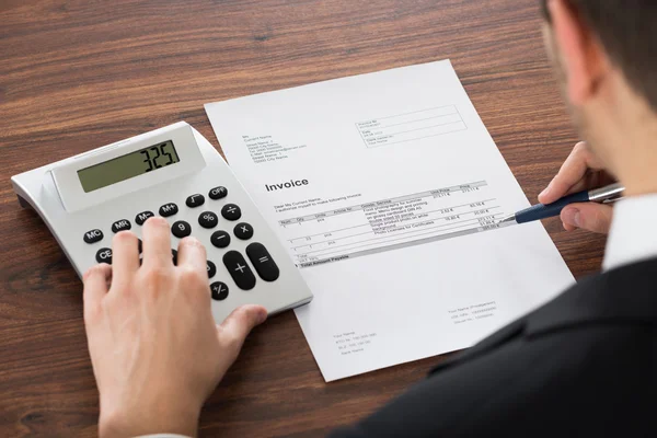 Young Businessman Calculating Bill — Stock Photo, Image