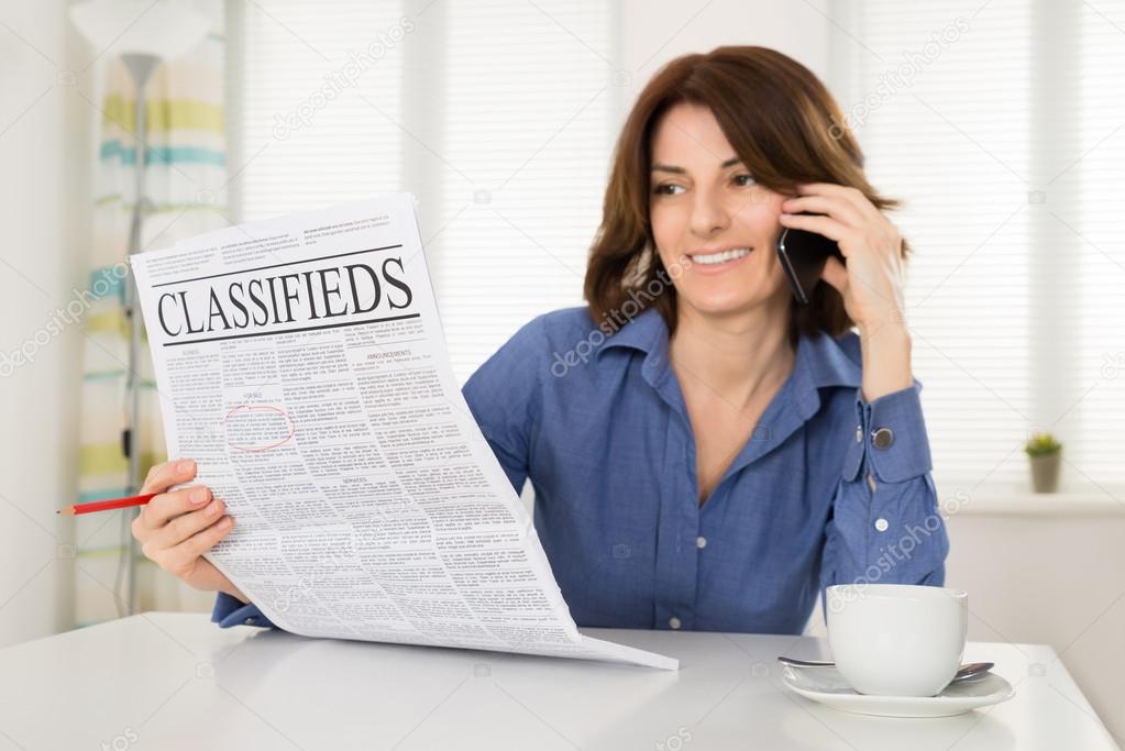 Woman Holding Newspaper