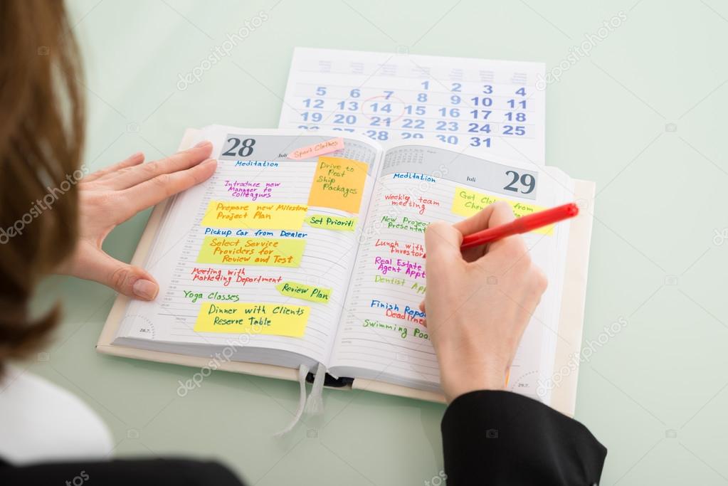 Businesswoman Writing Schedule