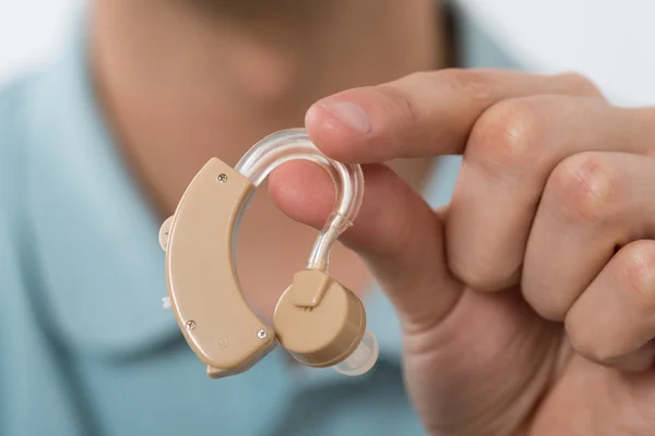 Holding Hearing Aid — Stock Photo, Image