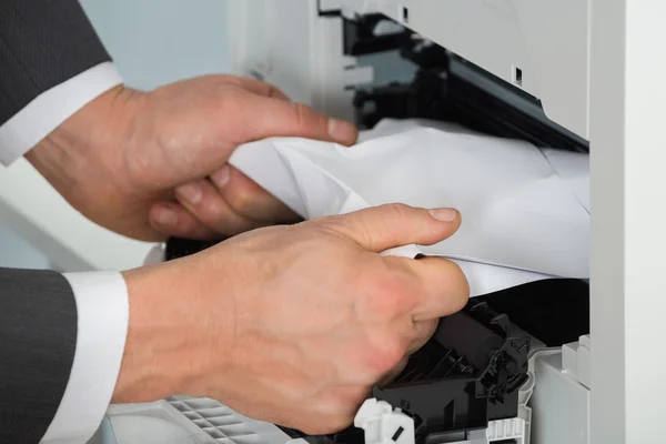 Businessman Removing Paper — Stock Photo, Image