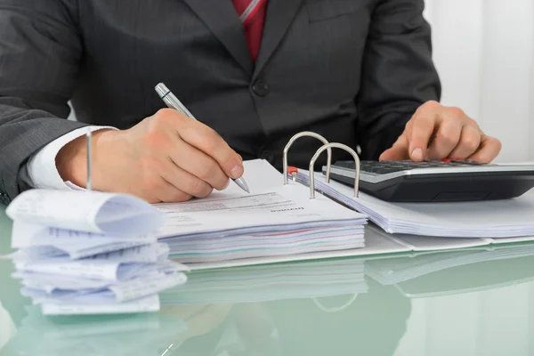 Businessman Calculating Tax — Stock Photo, Image