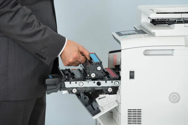 Businessman Fixing Cartridge — Stock Photo, Image