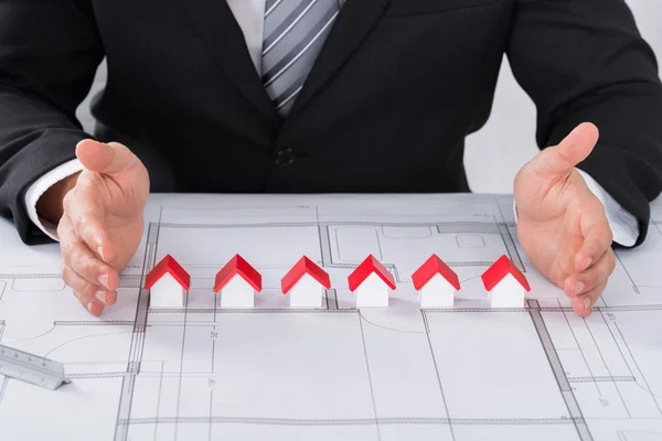 Architect Protecting House Models — Stock Photo, Image