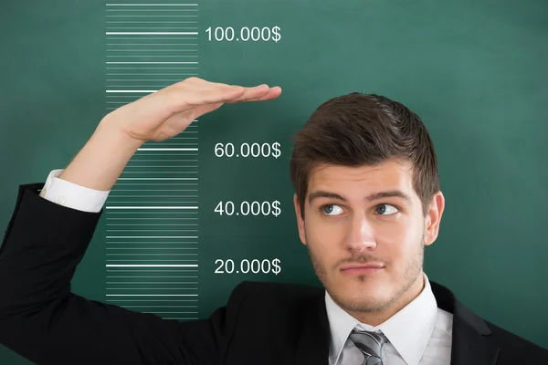 Businessman Measuring His Salary — Stock Photo, Image