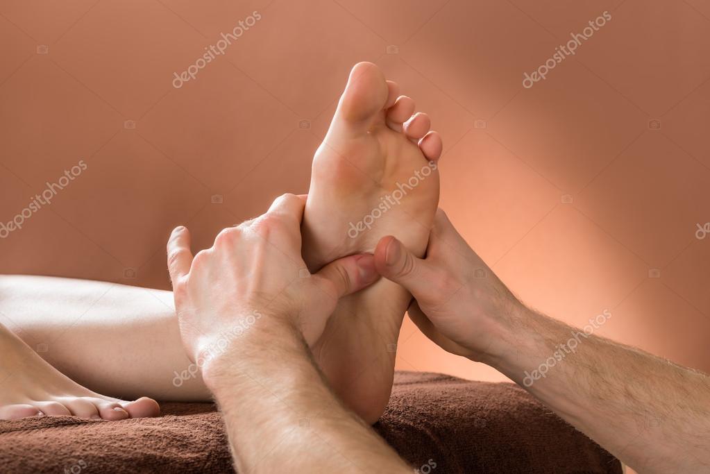 Woman Receiving Foot Massage Stock Photo by ©AndreyPopov 105727378