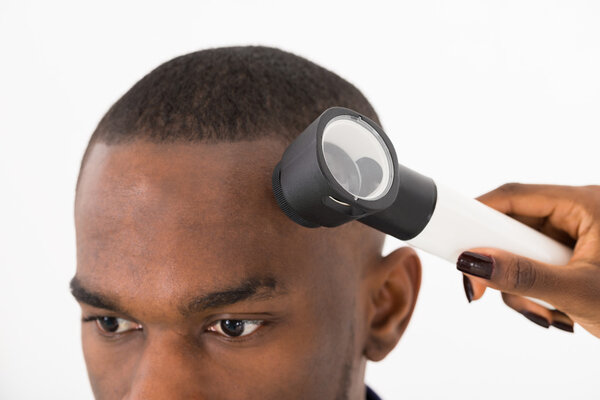 Dermatologist Checking Mole