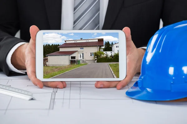 Male Architect Showing Picture Of House — Stock Photo, Image