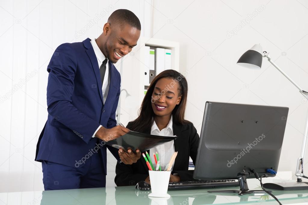 Download - Young African Businesspeople Working On Computer At Office - Sto...