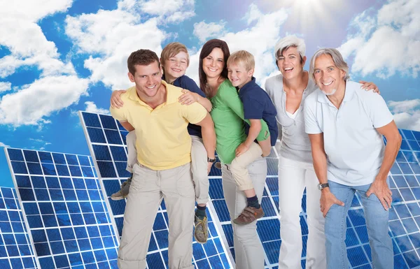 Family Standing Against Solar Panels — Stock Photo, Image