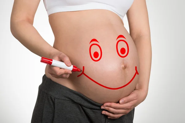 Face On Belly Of Pregnant Woman — Stock Photo, Image