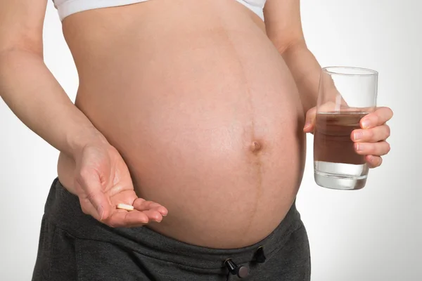 Pregnant Woman With Vitamin Pill — Stock Photo, Image