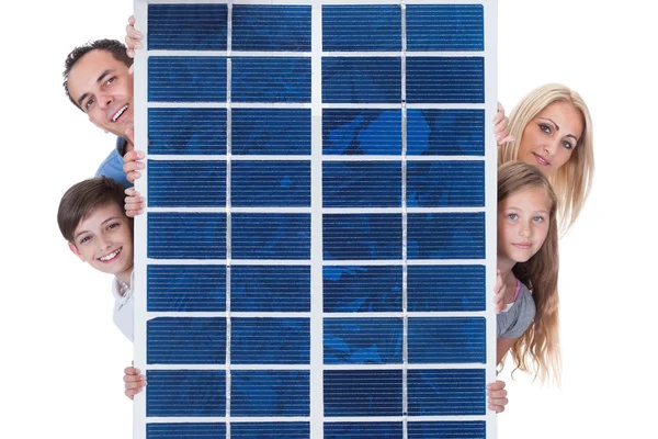 Family Peeping From Solar Panel — Stock Photo, Image
