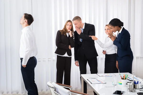 Businesspeople Gossiping In Office — Stock Photo, Image