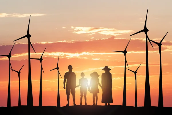 Silhouettes Of A Family in front of windmills — Stock Photo, Image