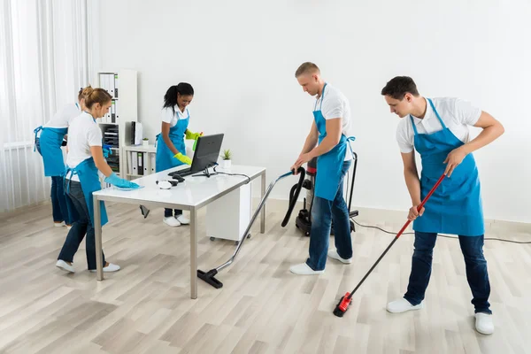 Group Of Janitors Cleaning The Office — Stock Photo, Image