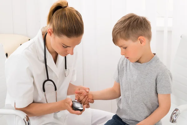 Doctor Examining Blood Sugar Of Little Boy — Stock Photo, Image