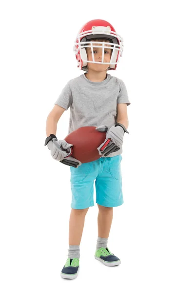 Boy v sportovní helma drží Rugby — Stock fotografie