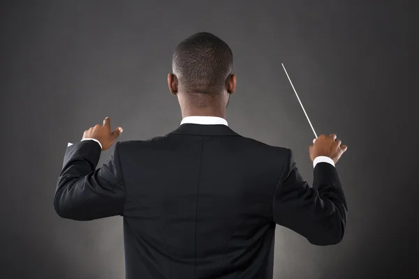 Conductor Directing With His Baton — Stock Photo, Image