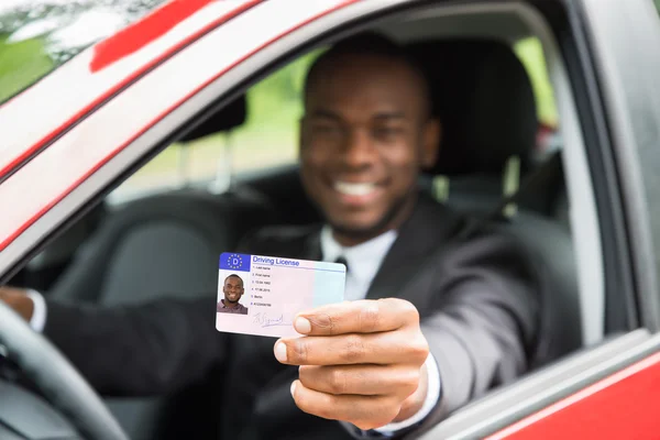 Businessman Showing His Driving License — Stock Photo, Image