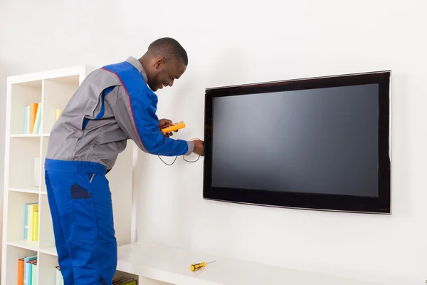 Electrician Checking Television With Multimeter — Stock Photo, Image