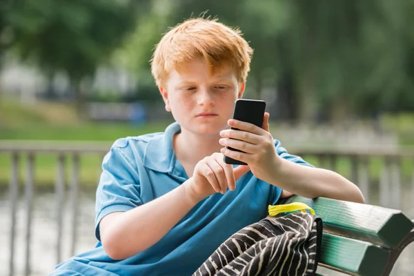 Schoolboy Using Smartphone — Stock Photo, Image