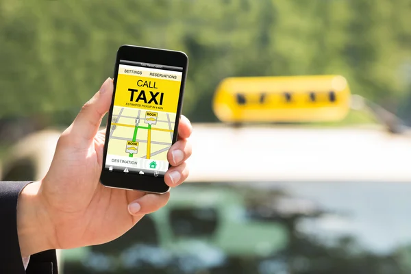 Person Hand Holding Mobile Phone Booking Taxi — Stock Photo, Image