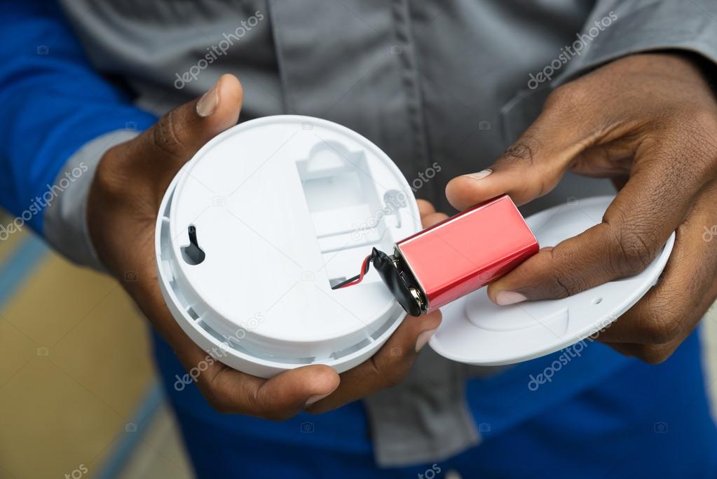 Electrician Removing Battery From Smoke Detector — Stock Photo