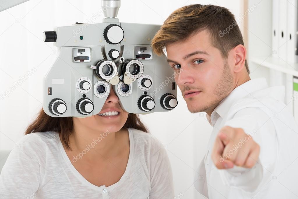 Male Ophthalmologist With Woman Stock Photo by ©AndreyPopov 119664596