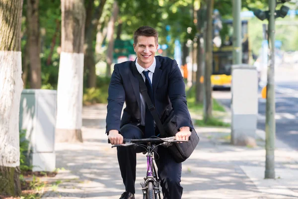 Male Businessman Riding Bicycle — Stock Photo, Image