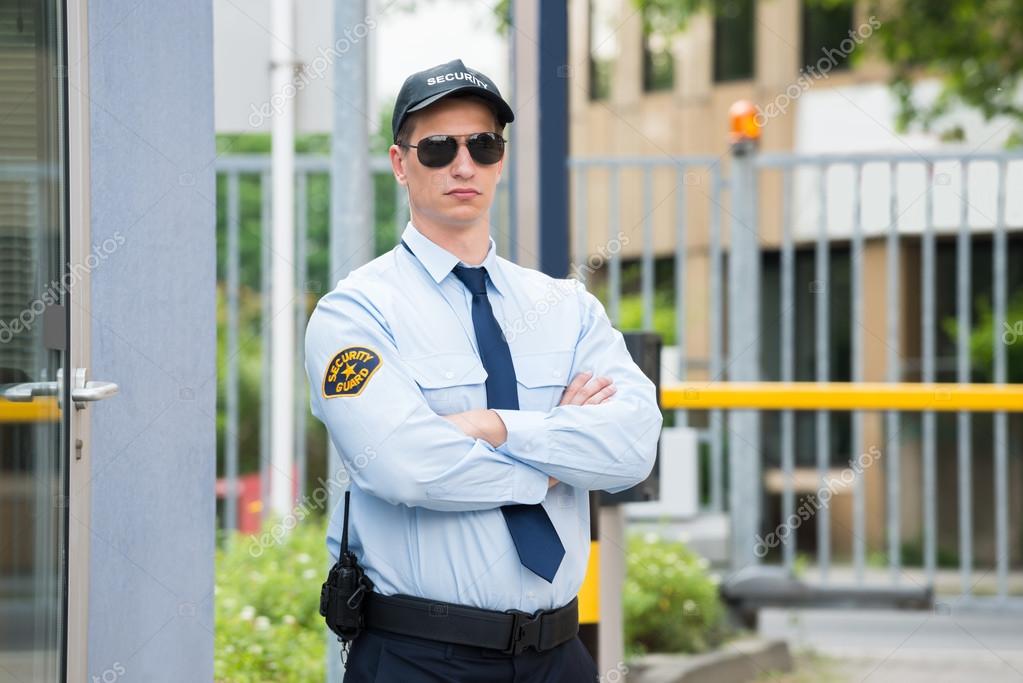 depositphotos_120485830-stock-photo-security-guard-standing-arm-crossed