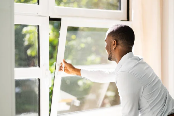 Fresh Air From Window. Side View Of Man Relaxing