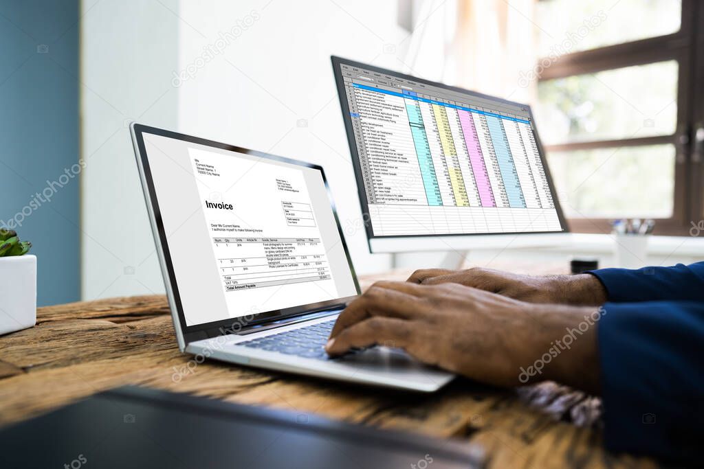 Young African Man Looking At Online Taxes Invoice On Computer