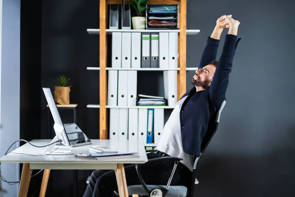 Stretch Exercise At Office Stretches While Sitting On Chair