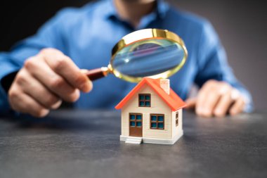 House Or Home Inspection Using Magnifying Glass. Tax And Insurance clipart