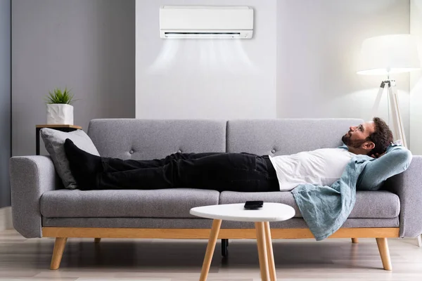 Happy Man Relaxing Enjoying Cool Air Conditioner — Stock Photo, Image