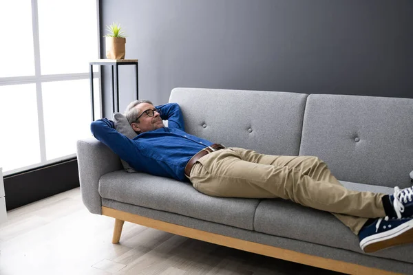 Senior Man Relaxing Sofa Living Room — Stock Photo, Image