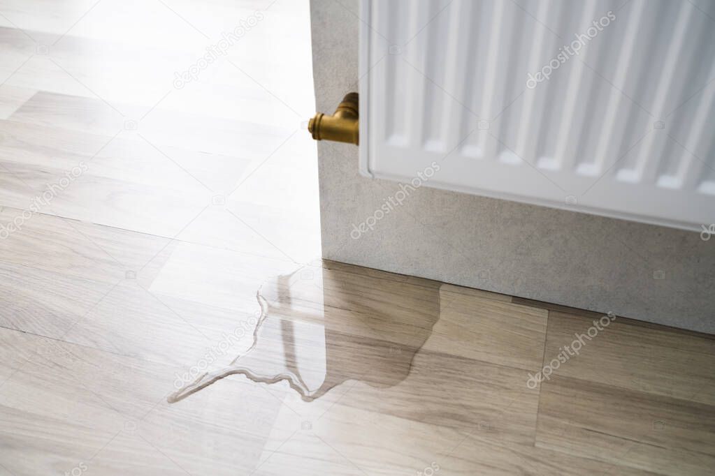 Laminate Floor Damage In Room After Heating Pipe Leakage