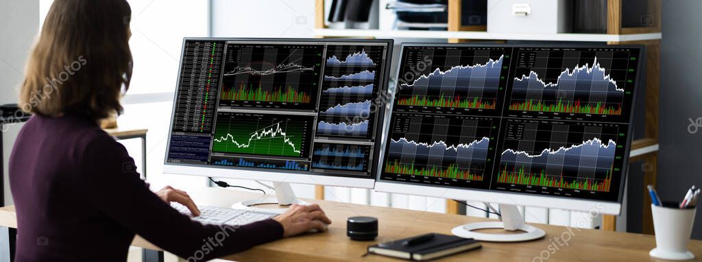 Financial Broker Or Trader Woman At Office Desk