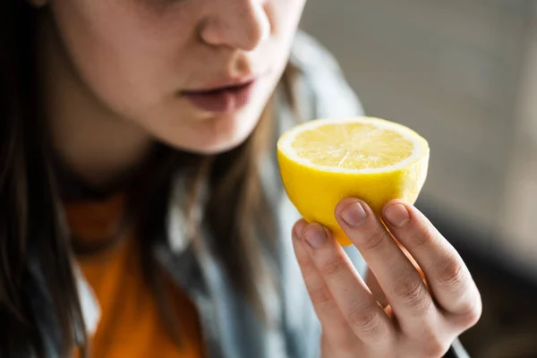 Woman Nose Sniffing Lemon Smell. Coronavirus Symptom