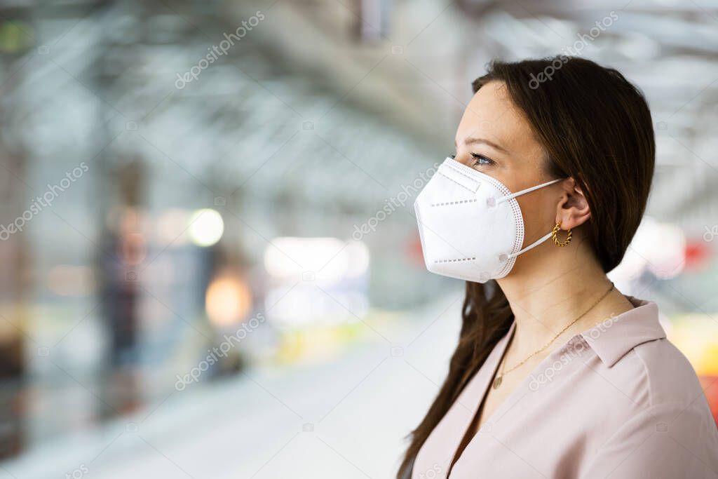 Plane Passenger In Airport Wearing Facemask Or Face Mask