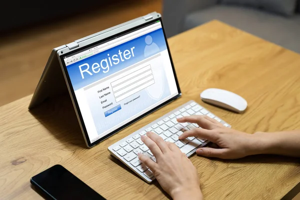 Filling Registration Web Form On Laptop Computer