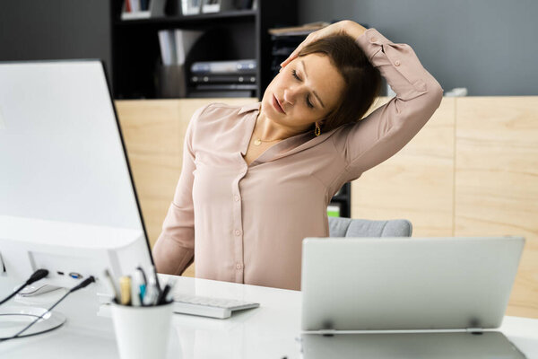 Woman Stretching At Office Desk. Worker Stretch Workout
