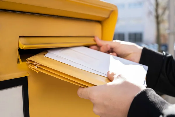 Person Putting Letters In Mailbox Stock Photo by ©AndreyPopov 91701034