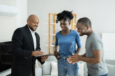 Agent Showing New Real Estate To African Couple clipart