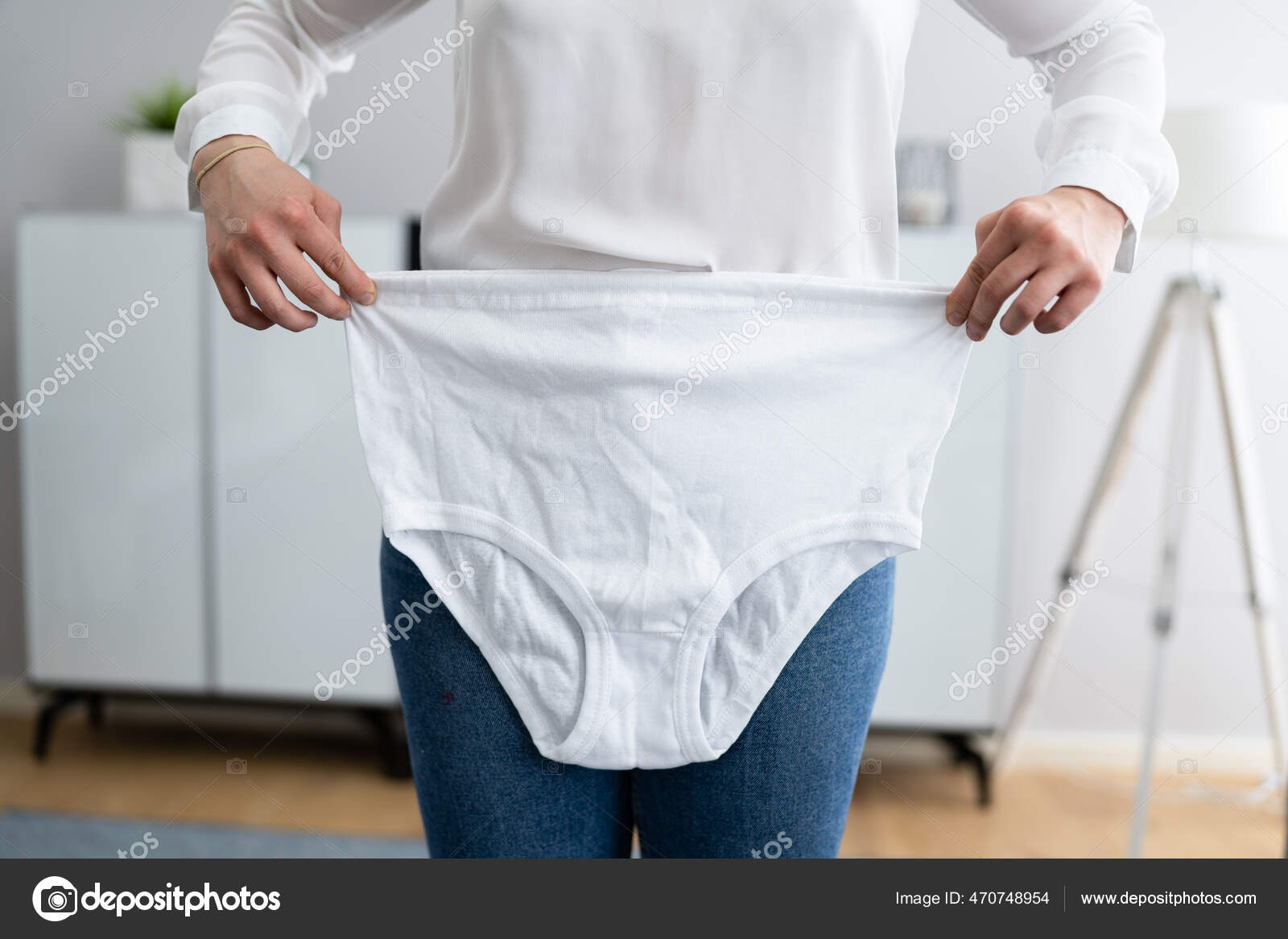 Woman Holding Loose Granny Underwear Panties Stock Photo by ©AndreyPopov  470748954
